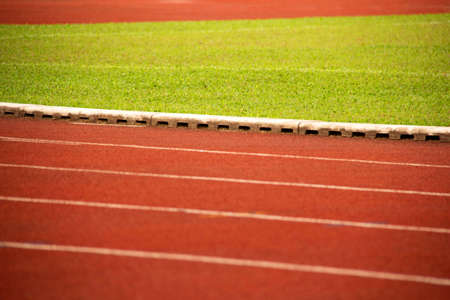 Running track and line cement with green lawn retro backgroundの写真素材