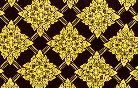 Thailand striped pattern on the wall,Thai traditional art. Thai Art Background, Thai art yellow pattern on black backgroundの写真素材