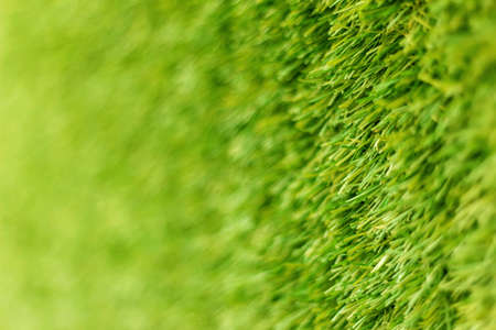 Artificial grass sport field blur wall backgroundの写真素材