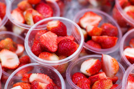 Strawberry sliced in the plastic cupの写真素材