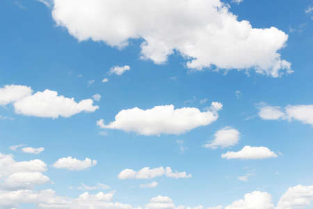 Soft white clouds against blue skyの写真素材