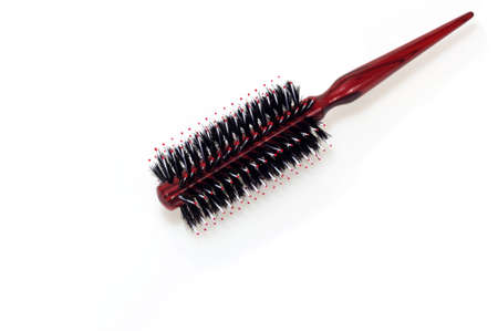 Wooden hairbrush roll  isolated on white backgroundの写真素材