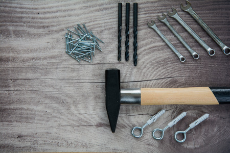 Arrangement of tools over a wooden panel with space for textの写真素材