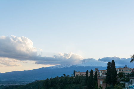 City of Taormina in Sicily with vulcano Etna in backgroundの写真素材