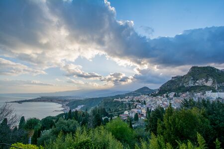 City of Taormina in Sicily with vulcano Etna in backgroundの写真素材