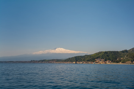 City of Taormina in Sicily with vulcano Etna in backgroundの写真素材