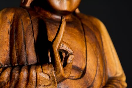 Low Key Portraiture of wooden Budda Statue from Thailandの写真素材