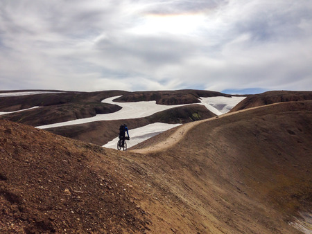 mountain biker cruising through iceland in Europeの写真素材