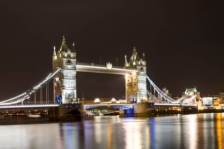Tower Bridge, London at night over the Themse Riverの写真素材