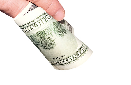Banknote of hundred dollars in a hand of a man isolated on whiteの写真素材