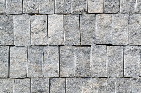 Closeup of an old and rustic stone wall suitable の写真素材