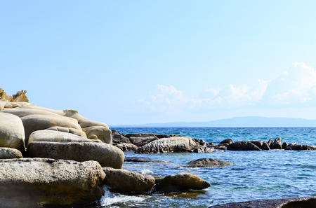Strange oval rocks by the sea in a beautiful sunny dayの写真素材