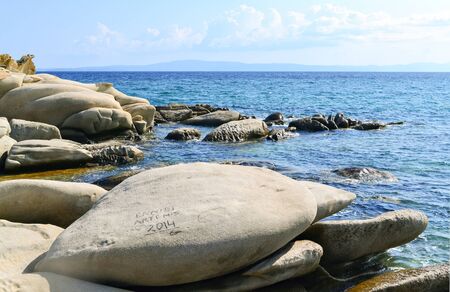 Strange oval rocks by the sea in a beautiful sunny dayの写真素材