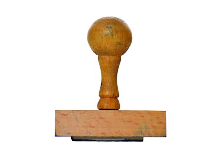 Wooden rubber stamp isolated on white backgroundの写真素材