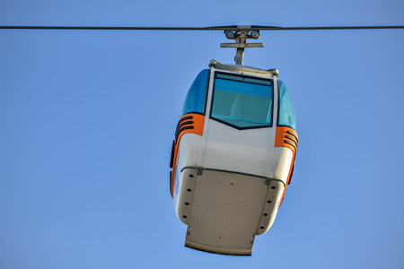 Closeup of a single wagon of the ropeway and clear sky