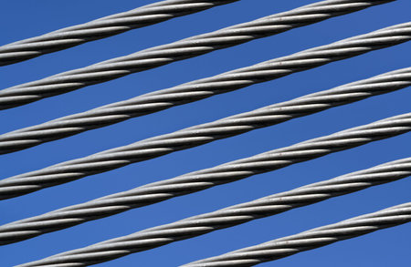 Closeup of a strong steel cable and clear sky in the background