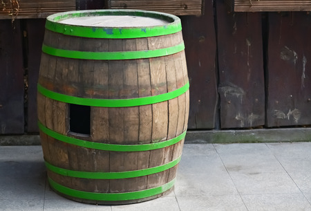 Closeup of an old wooden barrel for wine in the yardの写真素材