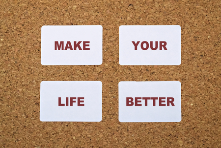 Text Make Your Life Better on white stickers pinned on cork boardの写真素材