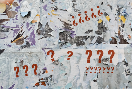 Many red question marks on bright torn backgroundの写真素材