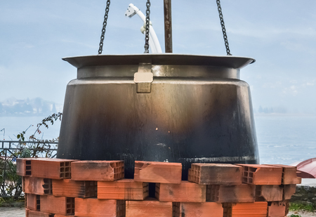 Closeup of a big cauldron for soup in Ohrid city by the lakeの写真素材