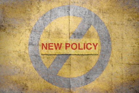 Text New Policy written in red on a golden backgroundの写真素材