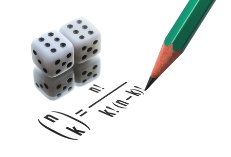 Two dices and written combinatorial formula isolated on white backgroundの写真素材