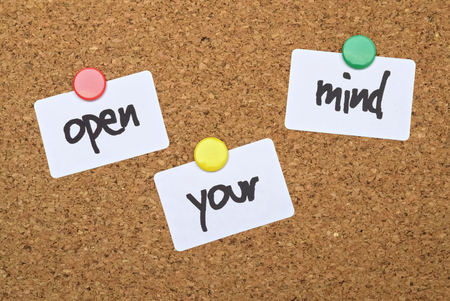 Text Open Your Mind written on pinned white stickersの写真素材