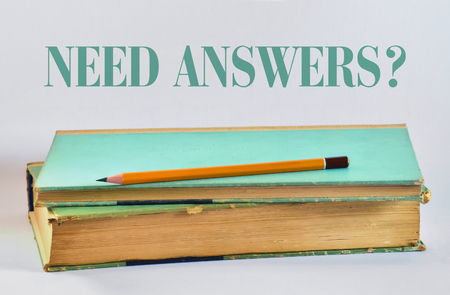 Yellow pencil over a book and text on a bright backgroundの写真素材