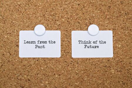 Phrase about the past and the future written on white stickersの写真素材