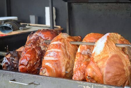 Several big pieces of broiled meat on the streetの写真素材