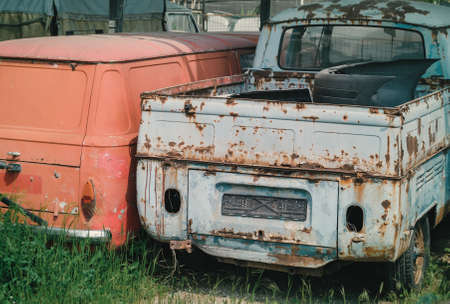 Detail of junkyard and disposal of old ruined cars ready for recyclingの写真素材
