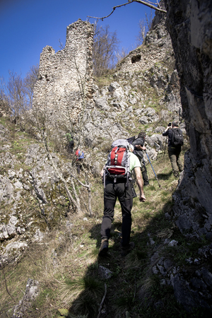 Group of friends walking along hiking trail path. Hikers on their adventure.の写真素材
