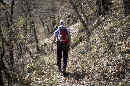 Strong hiker climbing on the mountain. Hiker on his adventure to the top.の写真素材