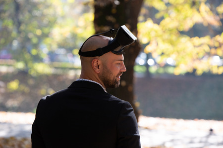 Man have fun with Virtual Reality VR Headset BOXの写真素材