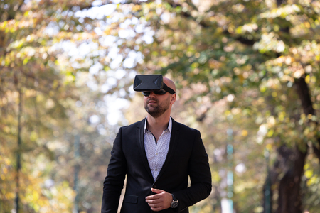 Man have fun with Virtual Reality VR Headset BOXの写真素材