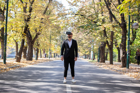 Man have fun with Virtual Reality VR Headset BOXの写真素材