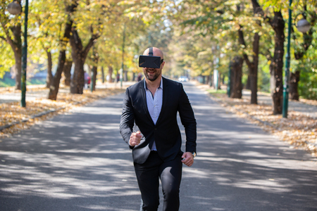 Man have fun with Virtual Reality VR Headset BOXの写真素材