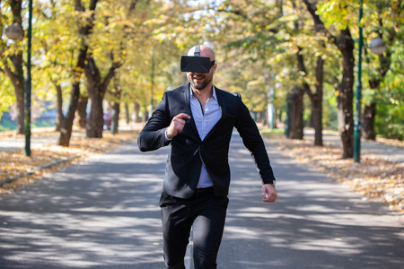 Man have fun with Virtual Reality VR Headset BOXの写真素材