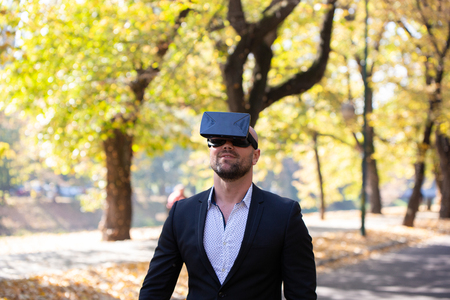 Man have fun with Virtual Reality VR Headset BOXの写真素材