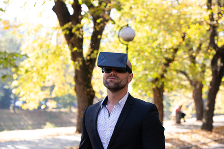 Man have fun with Virtual Reality VR Headset BOXの写真素材