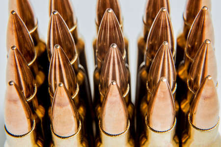 .308 cartridges lined up in rows.の写真素材