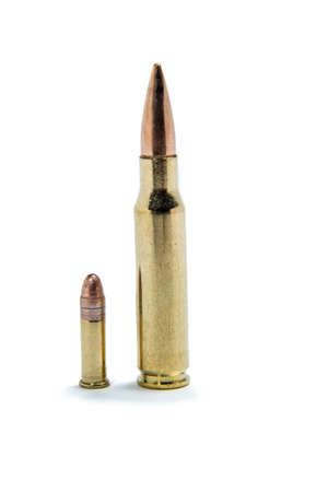 Size comparison of a .308 cartridge against a .22 long rilfe cartridge.の写真素材