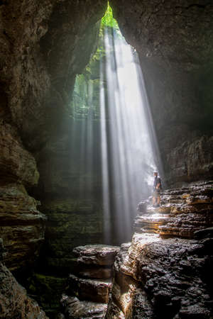 A caver rappells into Stephenの写真素材