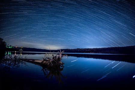 Shooting stars over the lakeの写真素材