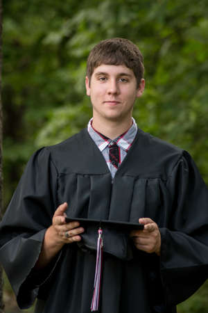 Young man after the graduation ceremonyの写真素材