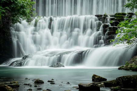Close up detail of a large waterfall in the forest.の写真素材