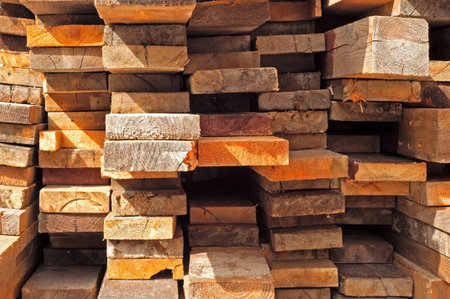 Many Stacked Boards in warehouse.