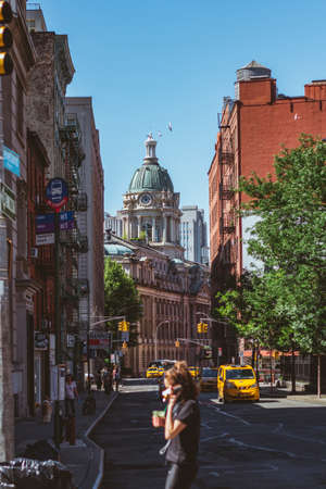 Buildings and a person telephoning next to chinatown in NYC, USAのeditorial素材