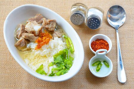 boiled rice with pork rib hot soup on bowlの写真素材