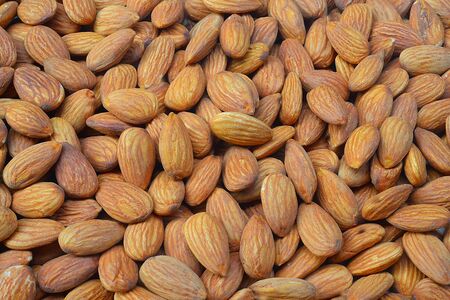 Closeup of whole almond nuts for backgroundの写真素材
